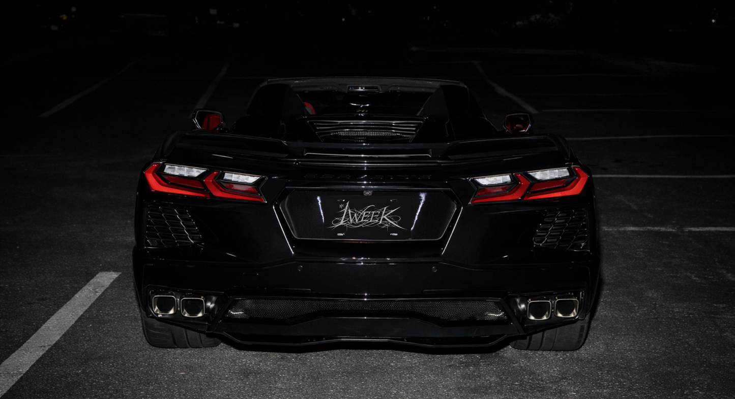 1WEEK Black car with a visible brand logo on a dark background