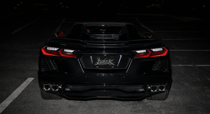 1WEEK Black car with a visible brand logo on a dark background