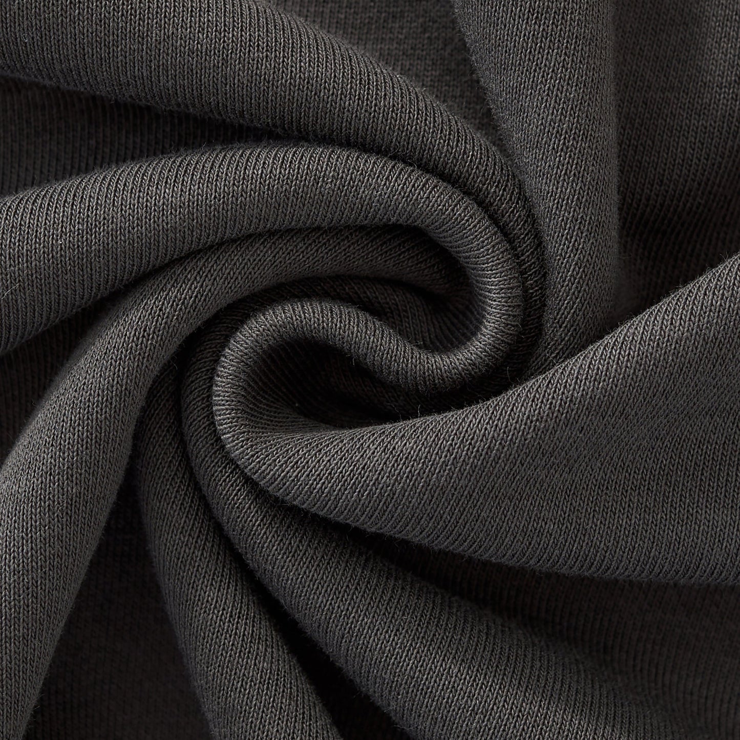 Close-up of dark gray fabric with folds
