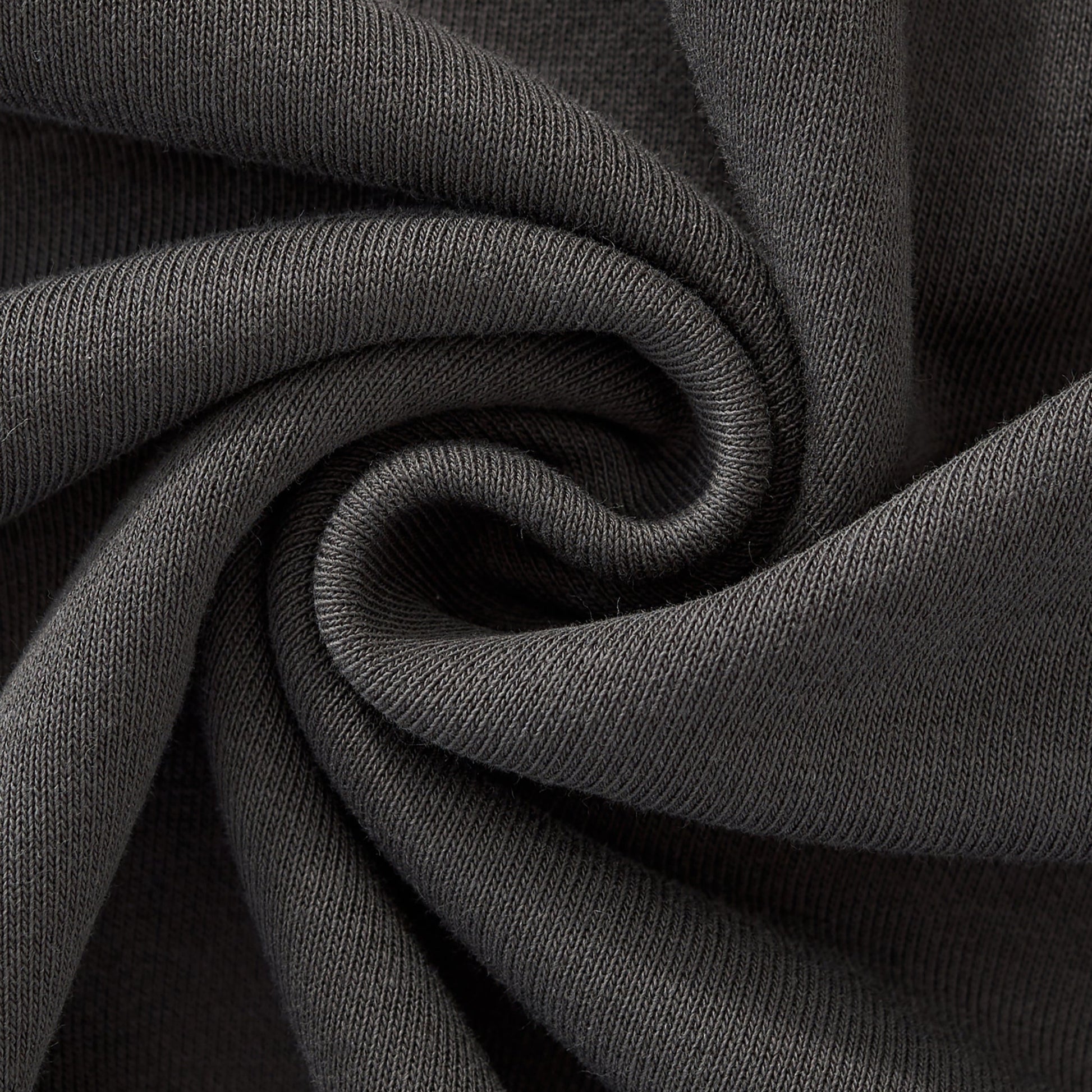 Close-up of dark gray fabric with folds